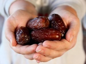 dates in a girl's hand
